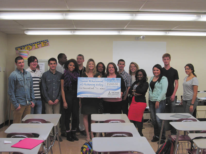 SPECIAL TO THE VINDICATOR
Home Savings Charitable Foundation has donated $5,000 to Junior Achievement of Mahoning Valley. The foundation’s support will be used for Junior Achievement’s K through 12 business programs and the JA Titan Business Challenge. Above, kids at Boardman High School enjoyed the visit from Home Savings. In the back row behind the check are Noelle Matiste, Boardman High School teacher; and in the front row behind the check are Michele Merkel, president of JA of the Mahoning Valley; and Colleen Scott, director of Home Savings Charitable Foundation.
