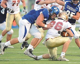 Poland senior linebacker Adam Wollet brings down Columbus Watterson running back Michael Auddino behind the line during the first half of a Sept. 19 game at Dave Pavlansky Field in Poland. The Bulldogs will play at Louisville on Friday in the first round of the Division III playoffs.