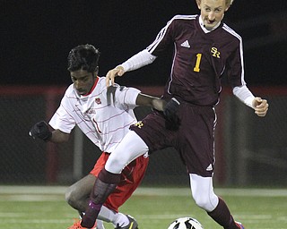 William D Lewis The Vindicator  SR'sSR's Brooks Thomas (1) and MAnsfield's Chandran Higgisn(1) during playoff action in Wadsworth 11-5-14.