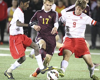 William D Lewis The Vindicator  SR's Mat Russ(17) looses the ball to Mansfields Chandran Higgins (1) left, and Steve Brown 9)(1) durining playoff action in Wadsworth 11-5-14.