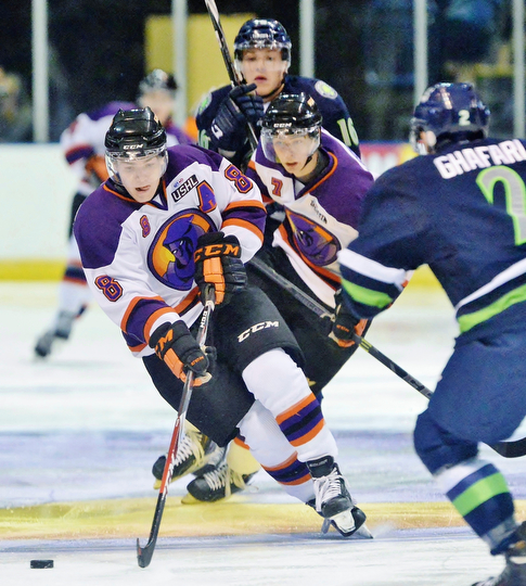 Jeff Lange | The Vindicator  Phantoms' Josh Melnick (8) cuts around the defense of Bloomington's Butrus Ghafari (right) toward the Thunders' goal, Wednesday morning at the Covelli.