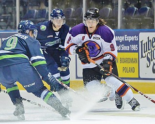 Jeff Lange | The Vindicator  Phantoms' Taylor Best (9) weaves in between Bloomington players Tyler Gernhofer (front left) and Jake Slaker (back) during first period action at the Covelli Centre, Wednesday morning.