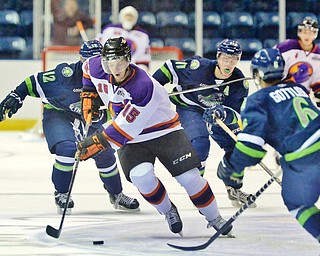 Jeff Lange | The Vindicator  Phantoms' Tommy Parran (15) weaves through a gauntlet of Bloomington players, Ryan Galt (12), Jack Jenkins (11) and Max Gottlieb (6) during second period action in Youngstown, Wednesday morning.