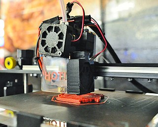 Jeff Lange | The Vindicator  Inventor Cloud's 3D printer was on display during Wednesday's Phantoms game. The 3D printer uses heated plastic to create anything from toy fish to miniature skulls in times of 3-6 hours depending on size.