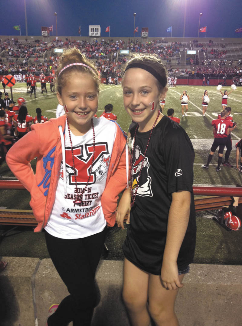 In the picture are Katie Justice (left) and Veronica Cionni at a 2014 YSU Football game. Both are 9 years old and live in Poland. Submitted by VeronicaÕs mom, Krissie Cionni.
