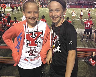 In the picture are Katie Justice (left) and Veronica Cionni at a 2014 YSU Football game. Both are 9 years old and live in Poland. Submitted by VeronicaÕs mom, Krissie Cionni.