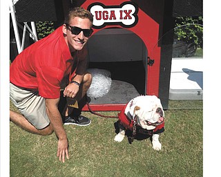 Gene Wollet, now attending grad school in Athens, Ga., played basketball for Canfield and graduated from YSU, is shown with UGA, voted number one mascot. Submitted by Greg Main.