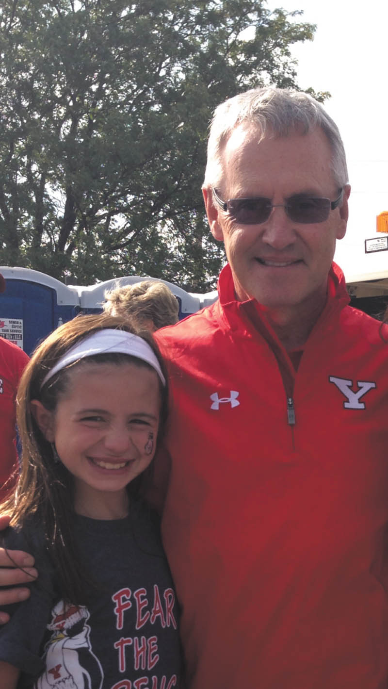 Best tailgating experience ever! Bree Latell, age 9, meeting President Tressel at the YSU Penguins tailgate! Submitted by Jen Latell.