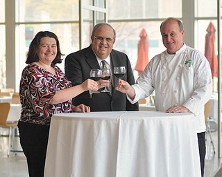 SPECIAL TO THE VINDICATOR Preparing for Nouveau Beaujolais are, from left to right, Katie Merrill, reservations chairwoman; Mark G. Mangie, Symphony Society chairman of the board; and Jeffrey Chrystal, Overture executive chef.
