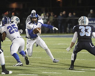  .          ROBERT  K. YOSAY | THE VINDICATOR..Poland #25 Anthony Audi  Blocks for #2 Dom Petrony     as he heads for yardage  during third quarter action as #33 Dalton Deckard for Louisville looks on..Poland Bulldogs vs Louisville Leopard at Louisville....-30-
