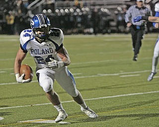  .          ROBERT  K. YOSAY | THE VINDICATOR..Polands #24  Austin Wilson.... finds a whole and heads for Poland TD during second quarter action..Poland Bulldogs vs Louisville Leopard at Louisville....-30-