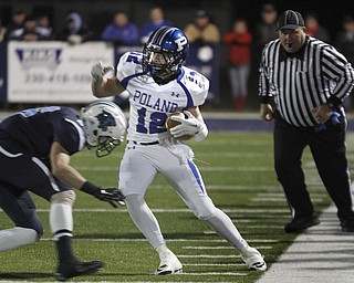  .          ROBERT  K. YOSAY | THE VINDICATOR..Polands #12 Tyler Smith  makes a cut at the line after a first down as he is pushed out of bounds by Louisville Dalton Deckard..Poland Bulldogs vs Louisville Leopard at Louisville....-30-