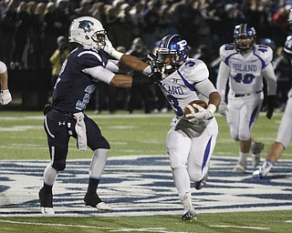 ROBERT  K. YOSAY | THE VINDICATOR..Pollands #3 Marlon Ramirez  stiff arms his way  past Lousiville #32 Stephen Kerzan  as he romps for 8 yards during first quarter action in Louisville..Poland Bulldogs vs Louisville Leopard at Louisville