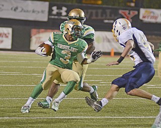 Katie Rickman | The Vindicator.United's Kimauni Johnson runs up field during the first quarter as United's Eric Blosser attempts to block him during thegame at Stambaugh on Saturday, Nov. 8, 2014.