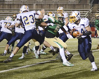 Katie Rickman | The Vindicator.United's Eric Blosser runs up the side during the first quarter of the game against Ursuline on Saturday, Nov. 8, 2014 at Stambaugh Stadium in Youngstown.