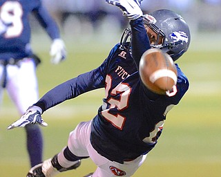 Jeff Lange | The Vindicator  Falcon wide receiver J.C. Mikovich (22) keeps an eye on the ball as he dives for a pass thrown just out of reach during first quarter regional quarterfinal action against the Wadsworth Grizzlies, Friday night in Austintown.