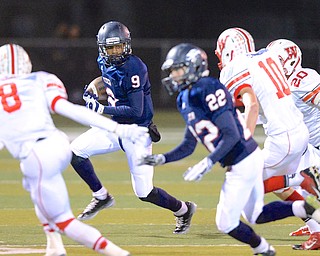 Jeff Lange | The Vindicator  Joey Harrington (9) wide receiver for the Falcons runs past Grizzly defenders during second quarter action of their regional matchup with Wadsworth in Austintown, Friday night.