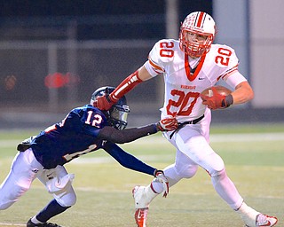Jeff Lange | The Vindicator Wadsworth's Austin White (20) breaks away from Austintown's Darrell Jackson (12) as he runs downfield during fourth quarter gameplay at Austintown, Friday night.