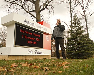        ROBERT K. YOSAY  | THE VINDICATOR..pics of Tom Ventresco, tech coordinator for the district, and one of the new signs....-30-