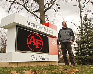        ROBERT K. YOSAY  | THE VINDICATOR..pics of Tom Ventresco, tech coordinator for the district, and one of the new signs....-30-