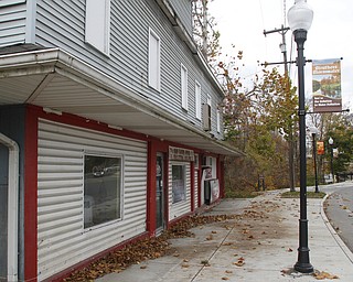        ROBERT K. YOSAY  | THE VINDICATOR..Vito Conniglio and his father-in-law have been working to remodel End Time Grafix, a graphics business in downtown Struthers. Conniglio and his father-in-law bought the building about a year ago. According to Conniglio, itÕs been almost not safe to do business in the building because of the buildingÕs deteriorating second floor. .-30-