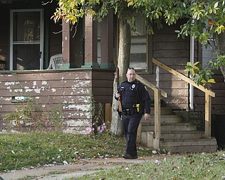        ROBERT K. YOSAY  | THE VINDICATOR..on Dennick Ave on the citys northside.. the YPD...  had a suspect in a  house with a gun...  after negotiating the suspect was taken away  by ambulance-30-