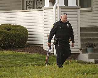        ROBERT K. YOSAY  | THE VINDICATOR..on Dennick Ave on the citys northside.. the YPD...  had a suspect in a  house with a gun...  after negotiating the suspect was taken away  by ambulance-30-