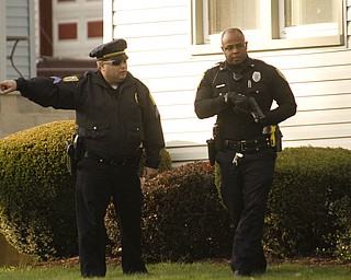        ROBERT K. YOSAY  | THE VINDICATOR..on Dennick Ave on the citys northside.. the YPD...  had a suspect in a  house with a gun...  after negotiating the suspect was taken away  by ambulance-30-