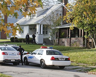        ROBERT K. YOSAY  | THE VINDICATOR..on Dennick Ave on the citys northside.. the YPD...  had a suspect in a  house with a gun...  after negotiating the suspect was taken away  by ambulance-30-