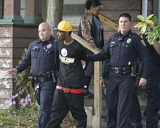        ROBERT K. YOSAY  | THE VINDICATOR..on Dennick Ave on the citys northside.. the YPD...  had a suspect in a  house with a gun...  after negotiating the suspect was taken away  by ambulance-30-