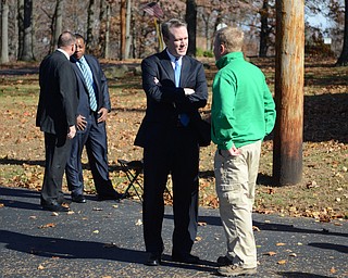 Katie Rickman | The Vindicator .Ed FitzGerald, on left speaks with Sean O'Brien at Nile United Methodist Church where he stopped to meet voters on Tuesday, Nov. 4, 2014.