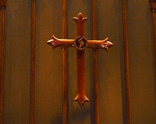 Katie Rickman | The Vindicator.A cross hangs above the altar at Girard First United Methodist church in Girard where Vickie Kelley is the lead pastor on Tuesday, Nov. 4, 2014.