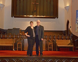 Katie Rickman | The Vindicator.Vickie and Ken Kelley stand on the stage at Vickie's church Girard First United Methodist on Tuesday, Nov. 4, 2014. Ken is also a preacher and he currently ministers at a church in Liberty.