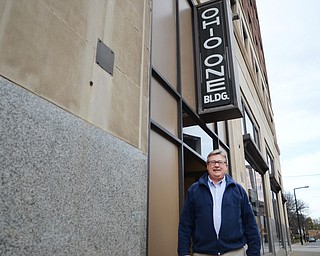 Katie Rickman | The Vindicator .John Lapin of Ohio One stands outside the building which is on the corner of Champion Street and Boardman Street in Youngstown on Tuesday, Nov. 4, 2014