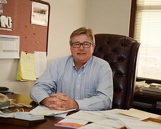 Katie Rickman | The Vindicator .John Lapin of Ohio One stands poses for a photo in  his office in the Ohio One building in Youngstown on Tuesday, Nov. 4, 2014