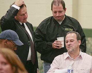        ROBERT K. YOSAY  | THE VINDICATOR..Mike Sciortino Enginer Pat Ginetti  and Dave Ditzler compare results as the election night results moved in slowly.