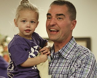        ROBERT K. YOSAY  | THE VINDICATOR..Biggest little support  is  Laney Rusu 2  gets a hug from Rob Rusu at  Lane Family Center in Boardman as they watch results of the Election