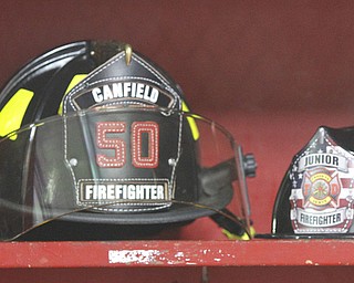        ROBERT K. YOSAY  | THE VINDICATOR..Little meets big as den 5 from Canfield United Methodist Church - as they toured the Canfield Fire Dept. .