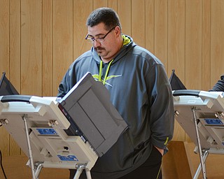 Katie Rickman | The Vindicator .Brad Harper of Niles votes at First Presbyterian Church of Niles on Tuesday, Nov. 4, 2014. Harper one of thousands that will vote in the Valley this election.