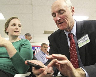William D. Lewis the Vindicator  Ralph Meachum is all smiles as he gets election results Tuesday at Mahoning County GOP headquarters he won the auditors race. With him is his daughter Molly Meachum.