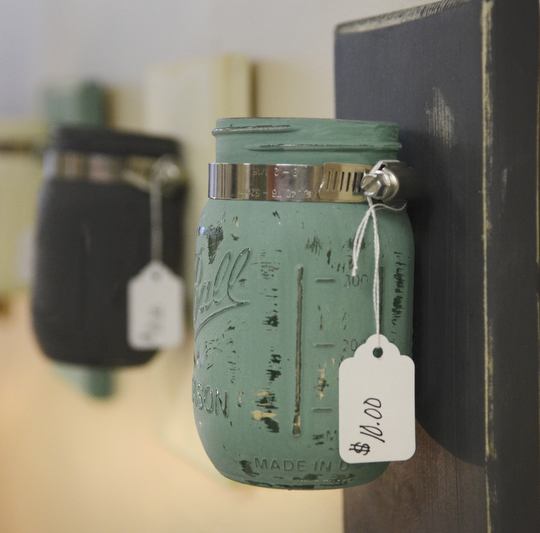 Katie Rickman | The Vindicator.Ashli Zinkhon and Adam Ruess recently moved there crafting business into an abandoned building in Struthers, they sell home made and refurbished home decor.