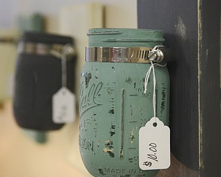 Katie Rickman | The Vindicator.Ashli Zinkhon and Adam Ruess recently moved there crafting business into an abandoned building in Struthers, they sell home made and refurbished home decor.