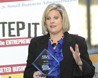 Katie Rickman | The Vindicator.Katie Burkey, graduate of the Emerging Leaders Program at YSU's Williamson College of Business Administration speaks after receiving her plaque on Wed. November 5, 2014.