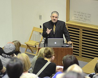 Katie Rickman | The Vindicator.Chris Yambar speaks to a large group of local artists during a panel discussion discussing artists and how to sell work and be successful at the McDonough Museum of Art on Wednesday, Nov 5, 2014.