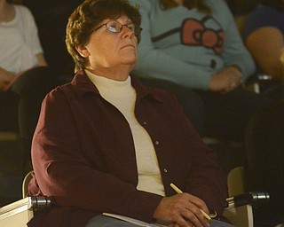 Katie Rickman | The Vindicator.Jeanne Bryner of Newton Falls watches a video by visual artist James Pernotto at the Power of the Arts panel discussion at McDonough Museum of Art on Wednesday, Nov. 5, 2014.
