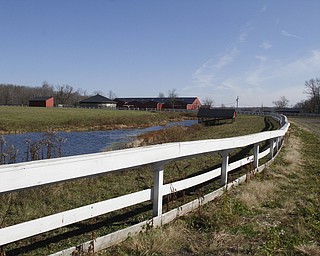        ROBERT K. YOSAY  | THE VINDICATOR..The Outdoor track and lake pasture..Jake and Shelly Radoseviches..moved their stable of horses from Grove City to Chardon to be closer to the racetracks up here. They will be involved heavily in Hollywood.
