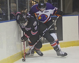 Katie Rickman | The Vindicator.Phantom's James Winkler attempts to steal from Chicago Steel's Dennis Gilbert during the 1st period of the game at the Covelli Centre on Sunday, Nov. 9, 2014.