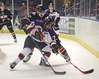 Katie Rickman | The Vindicator.Phantoms Taylor Best tries to keep control of the puck after a failed attempt at a goal during the third period as Chicago Steel's Brendon Kearney tries to steal on Sunday, Nov. 9, 2014.