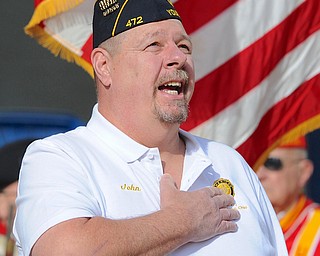 Jeff Lange | The Vindicator  John "Boots" Brinko leads everyone in saying the Pledge of Allegiance prior to the Reading of the Names ceremony during the 23rd annual Laying of the Roses, Sunday afternoon in Youngstown.