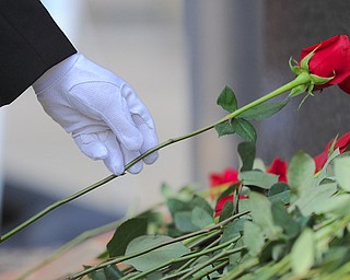 Jeff Lange | The Vindicator Many people showed up to place roses in front of the Vietnam Memorial, Sunday afternoon during the 23rd annual Laying of the Roses ceremony in Youngstown.